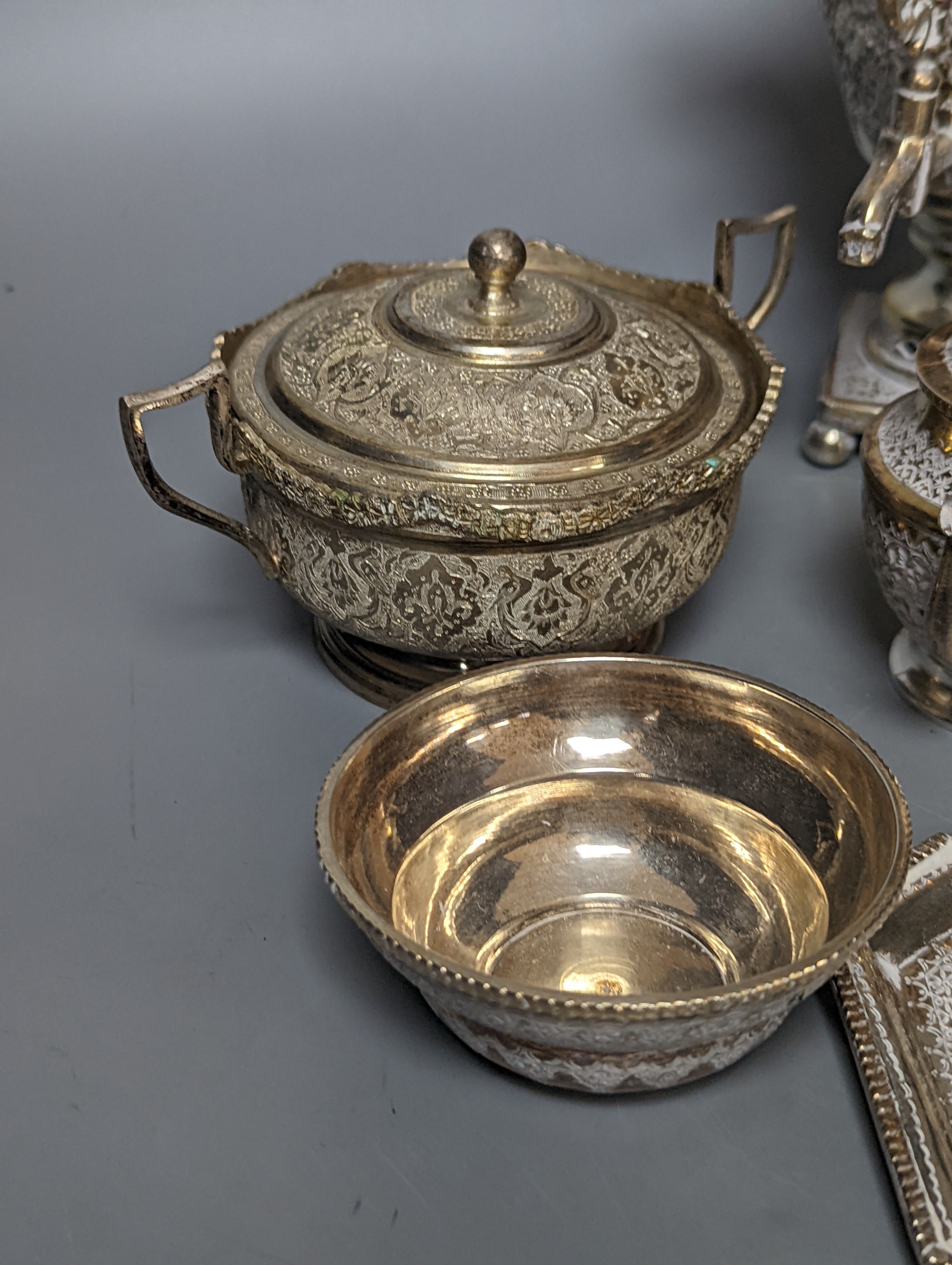 A set of six Persian embossed 84 standard white metal coffee cup holders and matching sugar bowl and cover by Vartan and four other Persian white metal items.